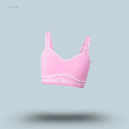 Alo Airbrush Heart Throb Bra in Candy Heart Pink/White, flat lay on light blue background