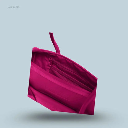 Gymshark Everyday Baguette Bag in pink displayed on a blue background with a bag storage details