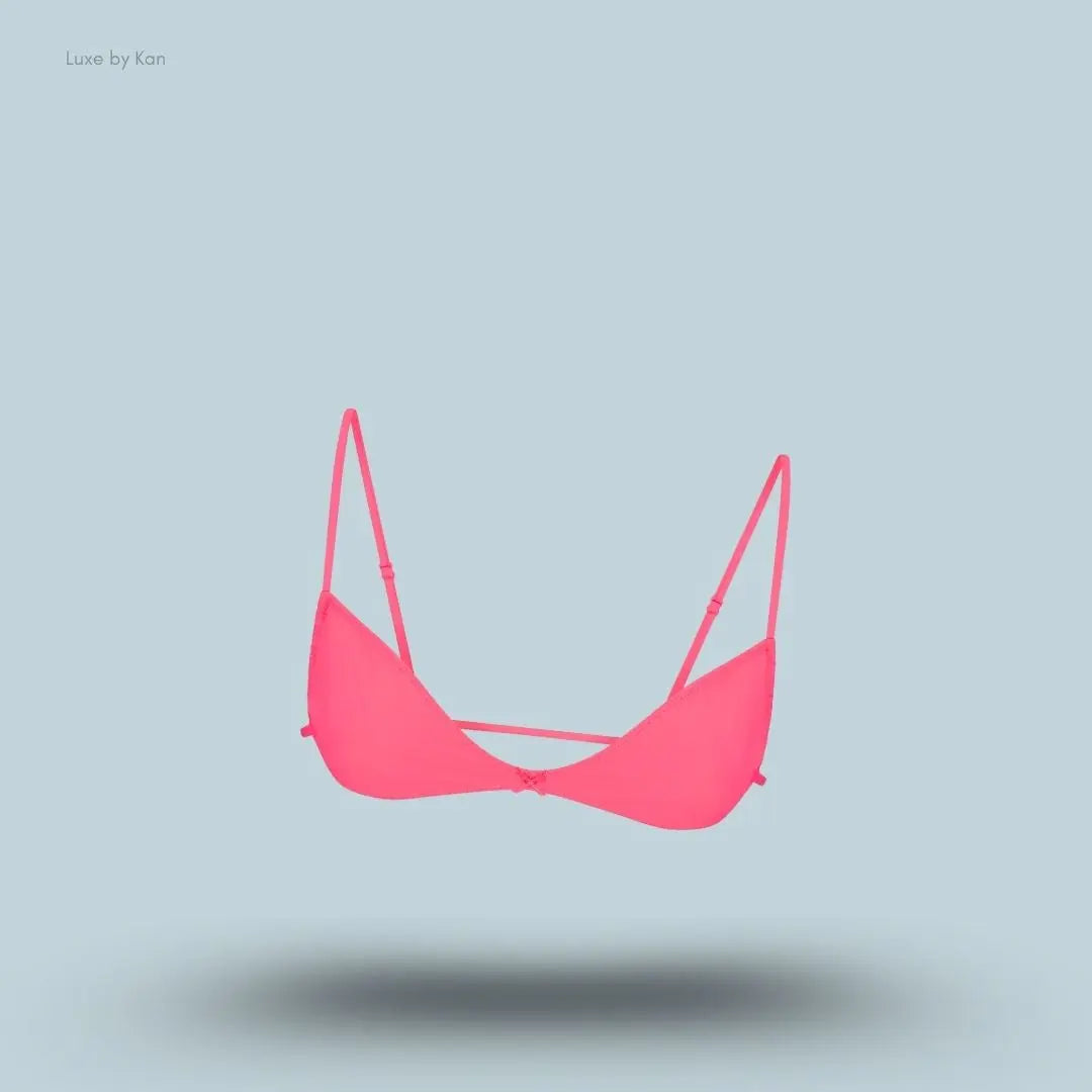 SKIMS Fits Everybody Micro Skimpy Bralette in Ultra Pink, flat lay on light blue background
