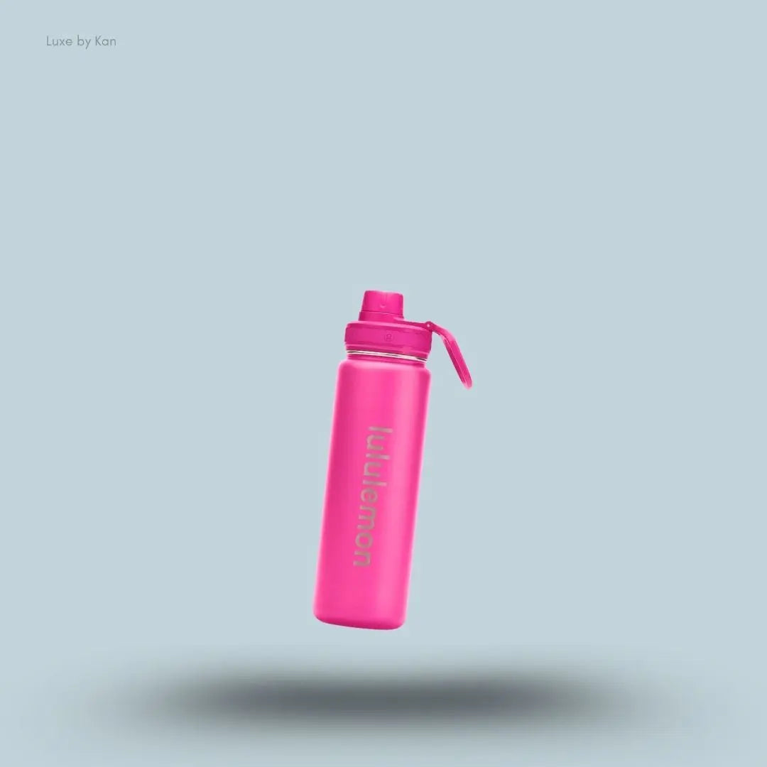 Lululemon Back to Life Sport Bottle 24oz in Pink Flare, flat lay on light blue background