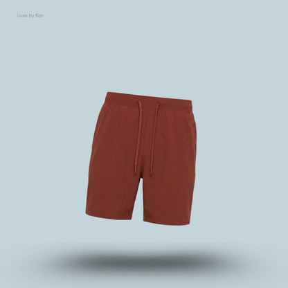 Lululemon Zeroed In Linerless Short 7 inch in red, flat lay on light blue background