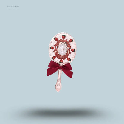 Flower Knows Strawberry Cupid Hand Mirror in Red Velvet, crimson strawberry cake design with golden Cupid