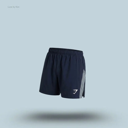 Gymshark Sport 5" Shorts men's slim-fit training shorts in hard blue with contrast side panels on a blue background