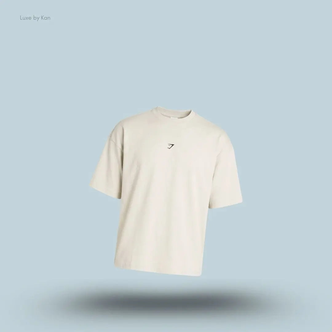 Gymshark Atlas T-Shirt oversized men's tinted white cotton graphic t-shirt on a blue background