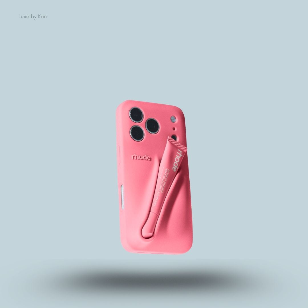 Rhode phone case in sweet pea against blue background; the word "rhode" embossed on the back, with loop for lip balm.
