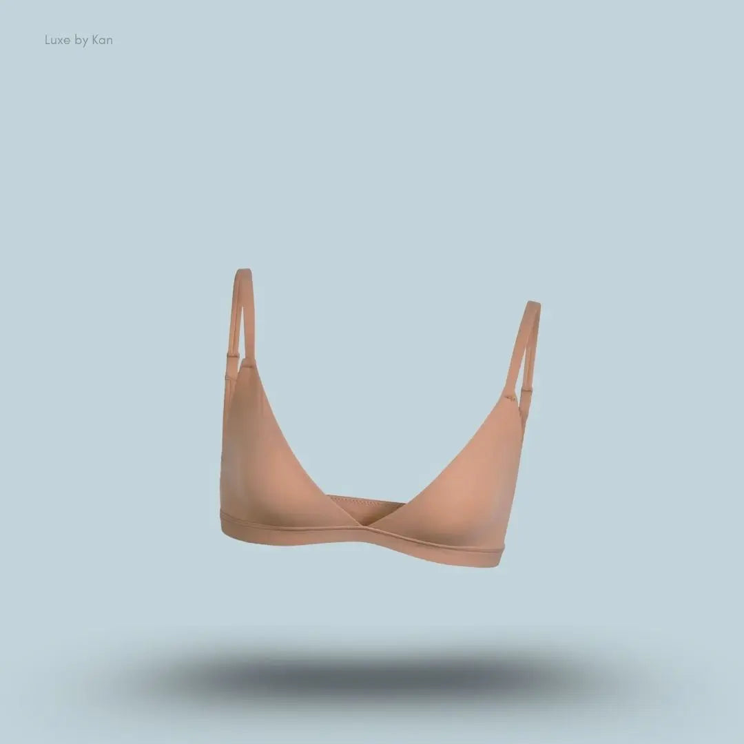 Skims Fits Everybody Triangle Bralette in nude, front view on a light blue background with a floating product display.