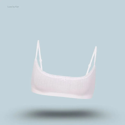 SKIMS Lightweight Cotton Pointelle Scoop Bralette in Snow, flat lay on light blue background