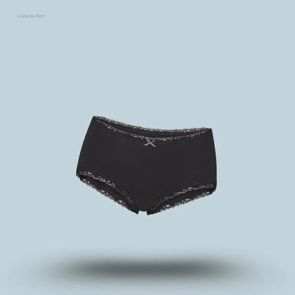 SKIMS Lightweight Cotton Lace Boy Short in Soot, flat lay on light blue background