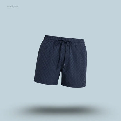 Lululemon Swim Short 5" Lined in Square Diamond Screen Navy Multi, flat lay on light blue background