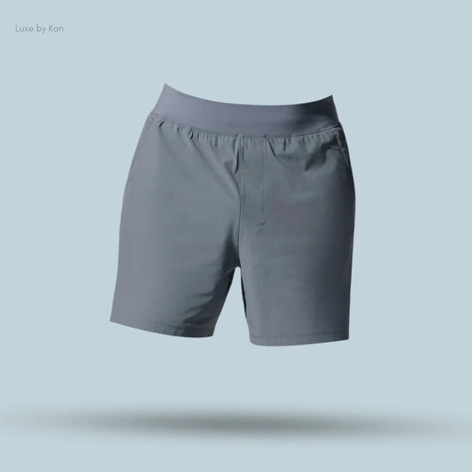 Alo 5 inch Repetition Short in Steel Grey, flat lay on light blue background
