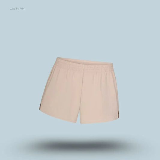 SKIMS Cotton Jersey Loose Short in Stone, flat lay on light blue background