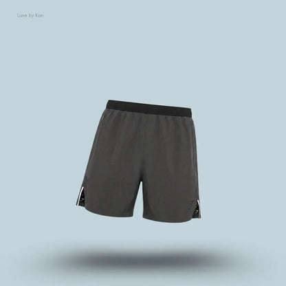 Gymshark Arrival Contrast Shorts in grey displayed on a blue background with a slim-fit athletic shorts design