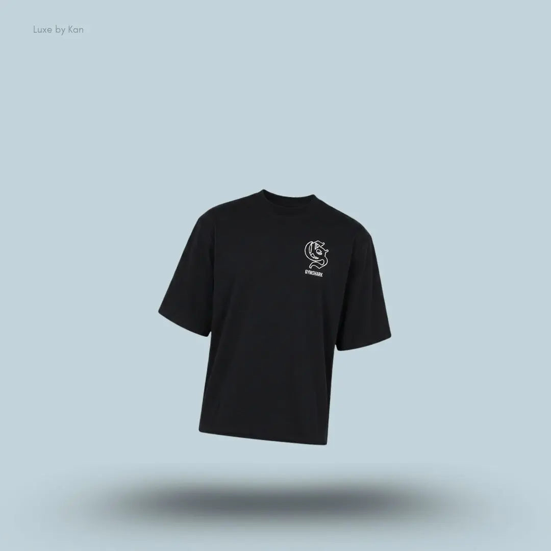 Gymshark Performance T-Shirt in black shade displayed on a blue background with an oversized boxy-fit short-sleeve design