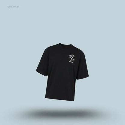 Gymshark Performance T-Shirt in black shade displayed on a blue background with an oversized boxy-fit short-sleeve design