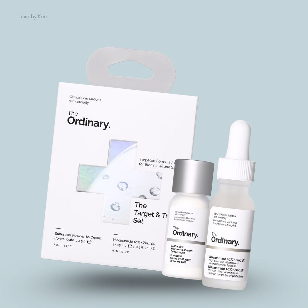 The Ordinary Target & Treat Set with Niacinamide serum and Sulfur spot treatment, flat lay on light blue background