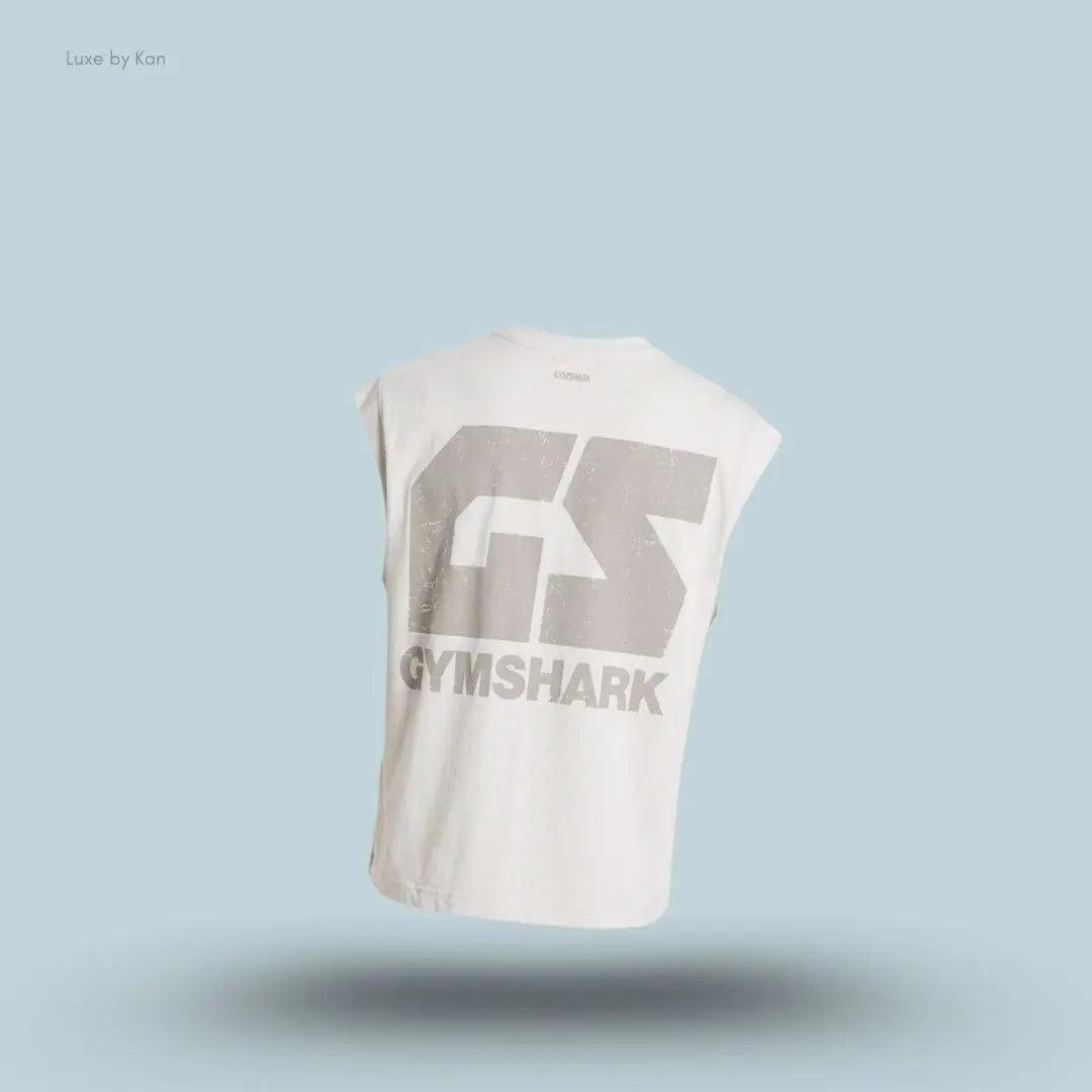 Gymshark Accent Capped Sleeve T-Shirt in tinted white shade displayed on a blue background with an oversized men's T-shirt design back view