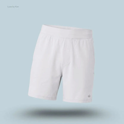 Alo 5 inch Repetition Short in Titanium, flat lay on light blue background