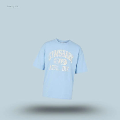 Gymshark Athletic Division Graphic T-Shirt in light blue with front graphic print on a blue background