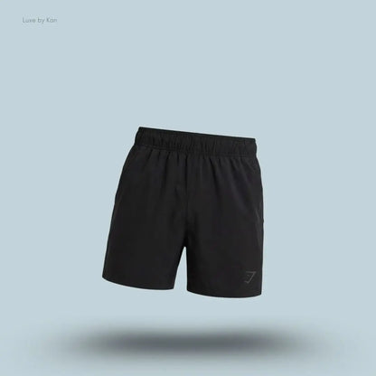 Gymshark Sport 5" Shorts men's slim-fit training shorts in black with same side panels on a blue background