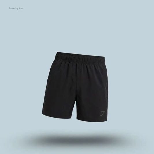 Gymshark Sport 5" Shorts men's slim-fit training shorts in black with same side panels on a blue background