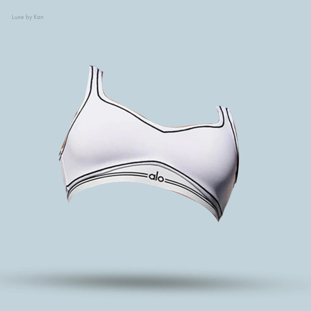 Alo Airbrush Heart Throb Bra in White/Black, flat lay on light blue background