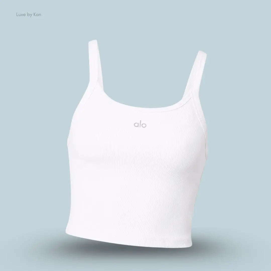Alo Seamless Ribbed Favorite Bra Tank in White, flat lay on light blue background