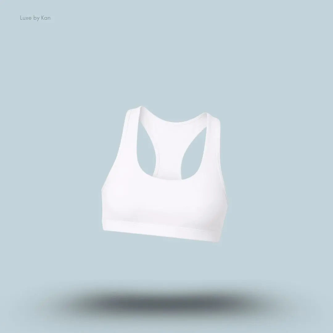 Alo Airlift Advantage Racerback Bra in White, flat lay on light blue background