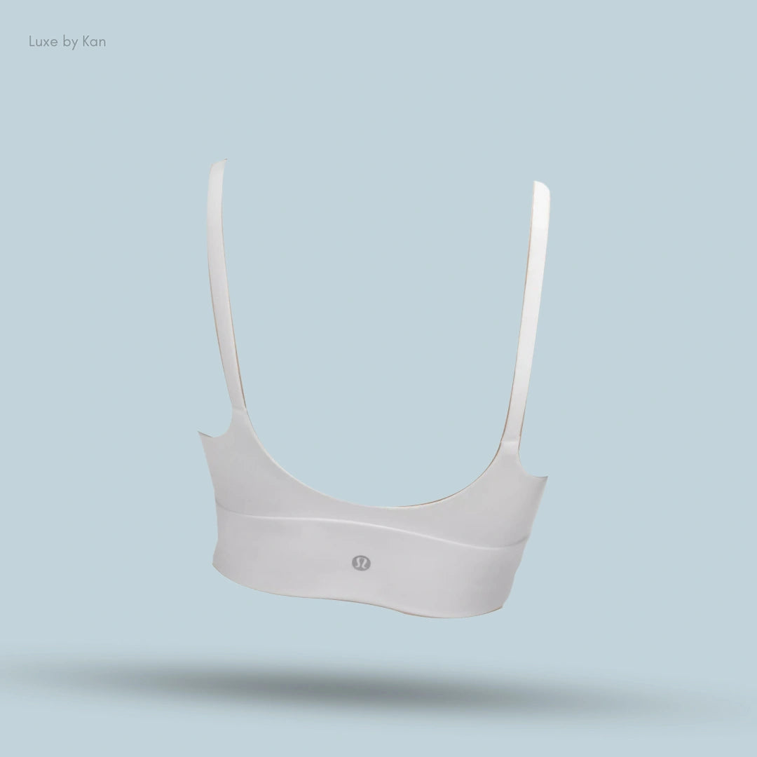 "Lululemon Focuser Scoop-Neck Bra in White, back view on light blue background"
