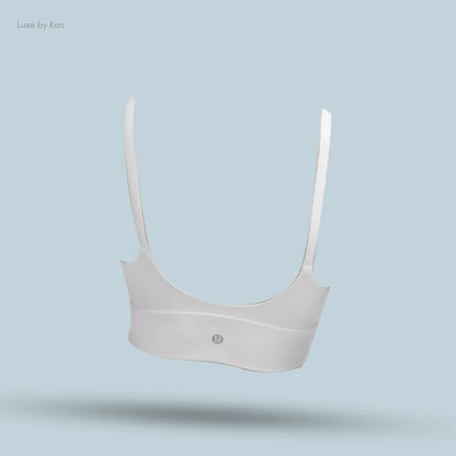 "Lululemon Focuser Scoop-Neck Bra in White, back view on light blue background"
