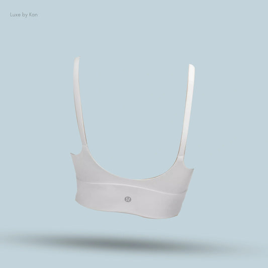 "Lululemon Focuser Scoop-Neck Bra in White, back view on light blue background"
