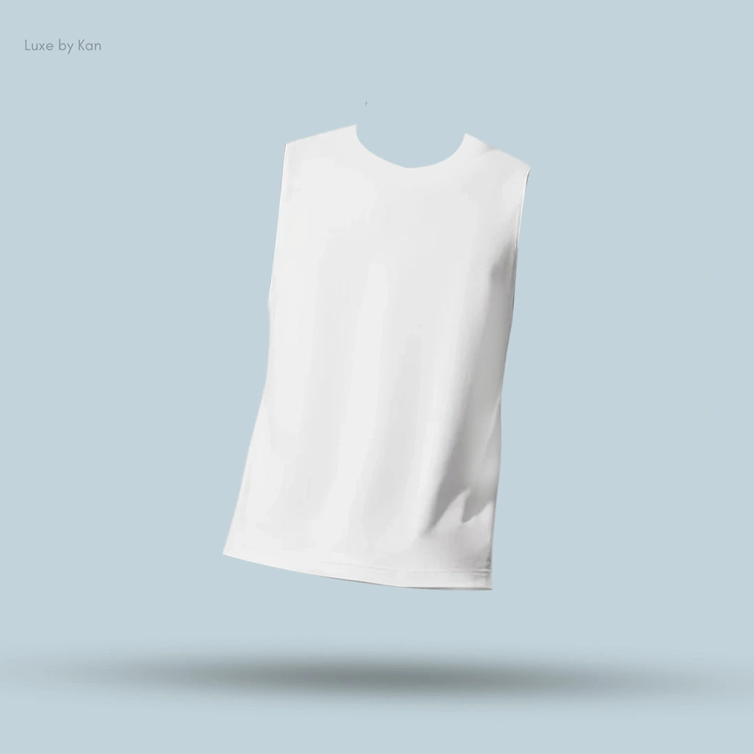 Alo Conquer Muscle Tank in White, flat lay on light blue background