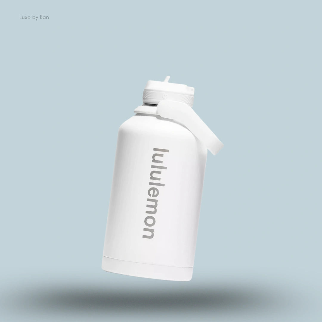 Lululemon Back to Life Sport Bottle 64oz in White, flat lay on light blue background