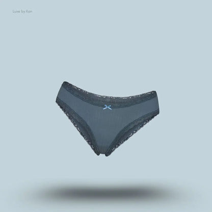 SKIMS Lightweight Cotton Pointelle Lace Brief in Zircon Tonal, flat lay on light blue background